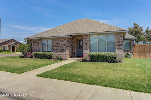 136 Preston Hollow Ln, Wolfforth, TX 79382 - view of front facade with brick siding and roof with shingles