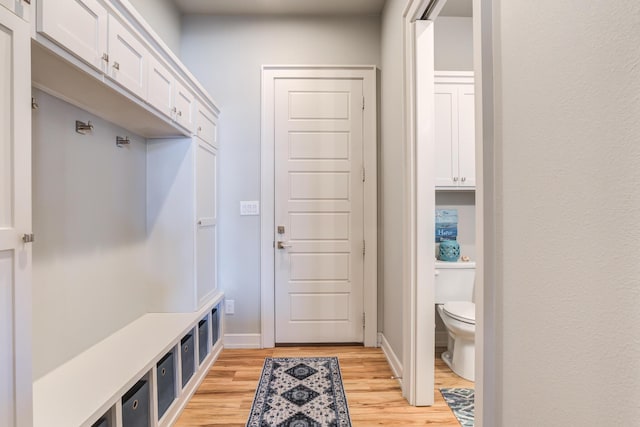 mudroom with light hardwood / wood-style floors