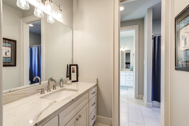 bathroom featuring tile patterned flooring and vanity