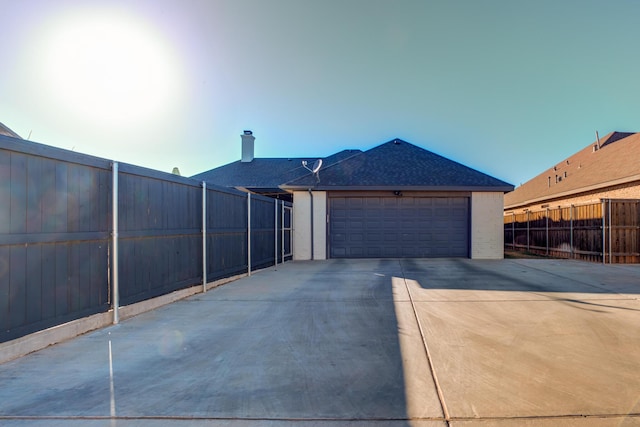 view of side of home featuring a garage