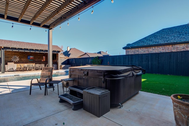 view of patio / terrace with a hot tub and a pergola