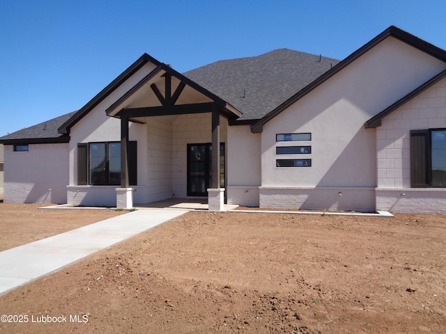 4622 140th St, Lubbock, TX 79423 - rear view of property with brick siding and a shingled roof