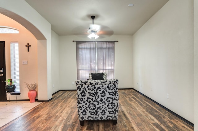 dining area with wood-type flooring and ceiling fan