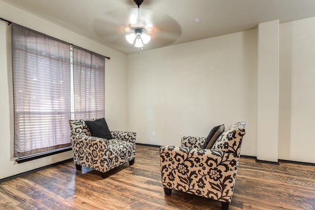 living area featuring ceiling fan and hardwood / wood-style floors