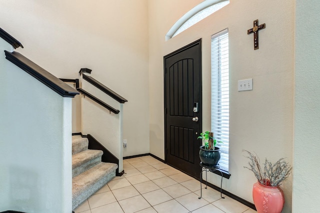 entrance foyer with light tile patterned flooring