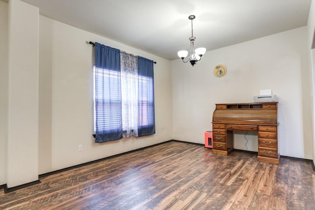 miscellaneous room featuring dark hardwood / wood-style floors and a notable chandelier