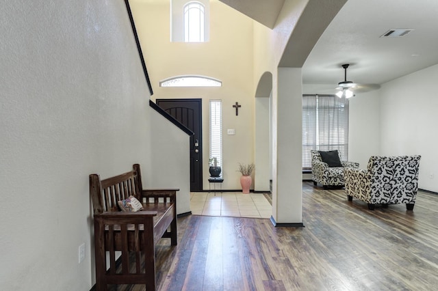 foyer with wood-type flooring and ceiling fan