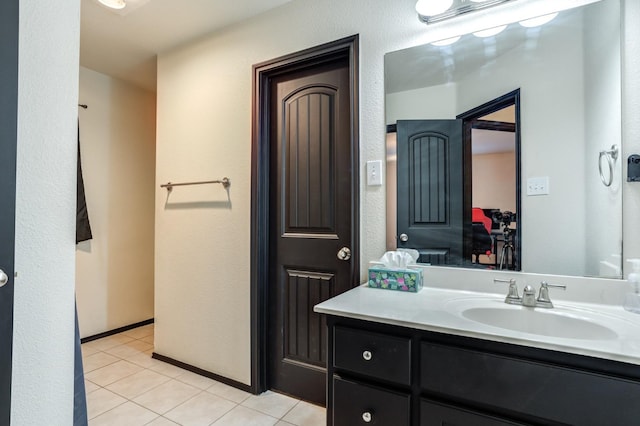 bathroom with vanity and tile patterned flooring