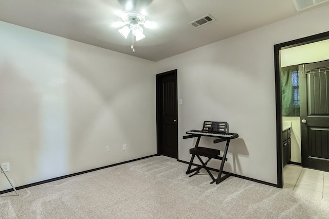 carpeted empty room with ceiling fan