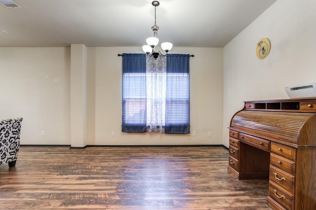 interior space featuring dark hardwood / wood-style floors and a chandelier