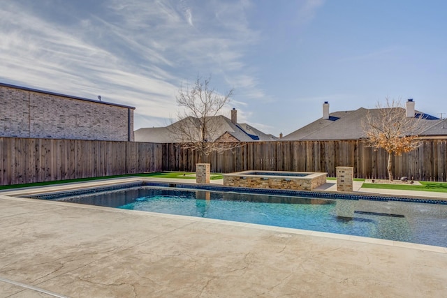 view of swimming pool featuring a fenced backyard, a patio, a fenced in pool, and an in ground hot tub