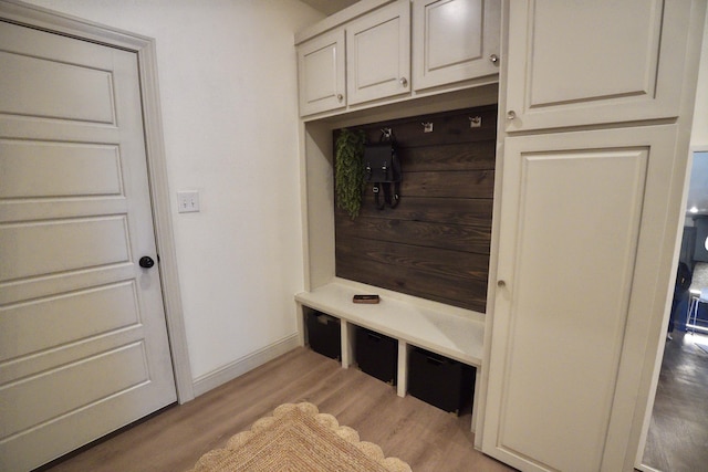 mudroom with light wood-style flooring and baseboards