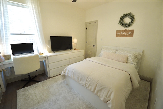bedroom with wood finished floors and a ceiling fan