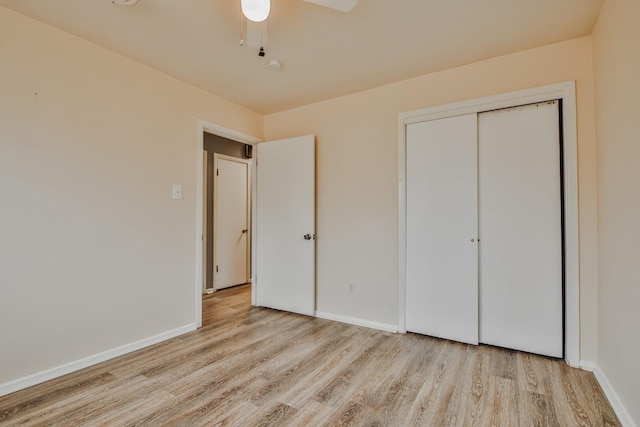 unfurnished bedroom featuring a closet, ceiling fan, and light hardwood / wood-style flooring