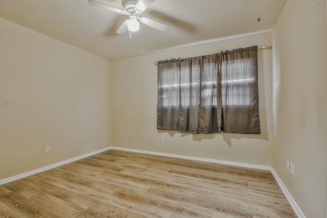 empty room featuring ceiling fan and light hardwood / wood-style floors