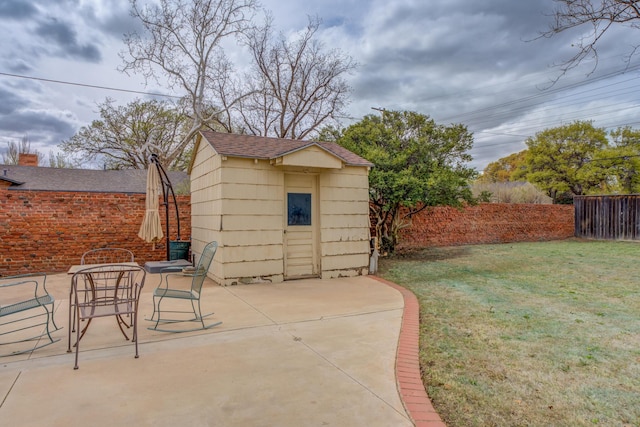 view of shed featuring a fenced backyard