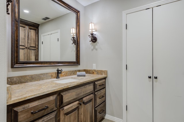 bathroom featuring visible vents and vanity