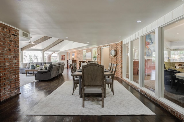 dining room featuring dark wood-style floors, a ceiling fan, visible vents, and a healthy amount of sunlight