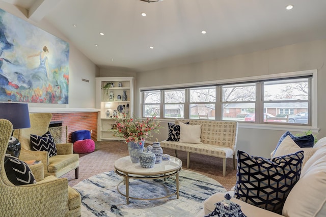 living room featuring carpet, lofted ceiling with beams, and a wealth of natural light