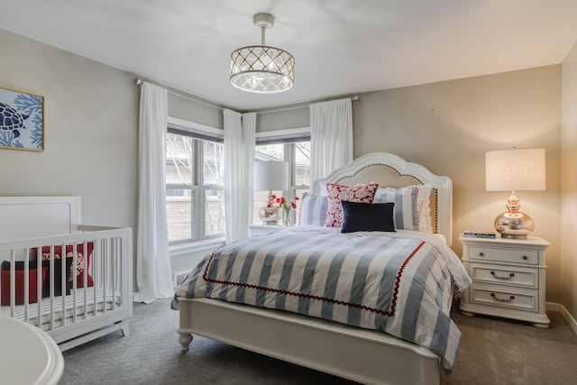 bedroom with carpet and baseboards