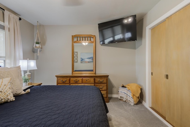 bedroom featuring baseboards and carpet floors