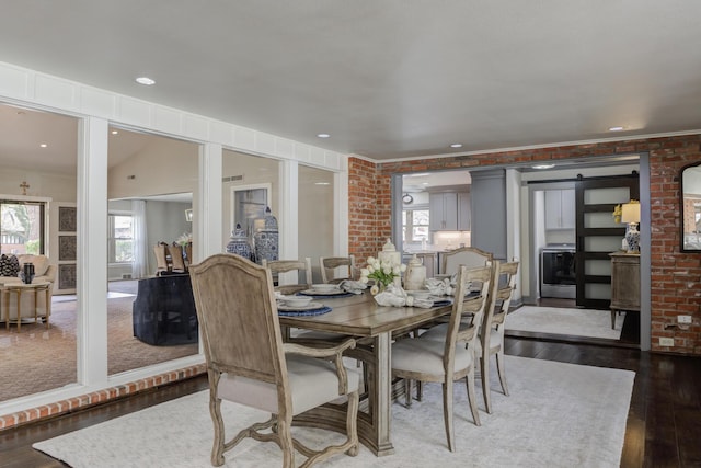 dining space with hardwood / wood-style floors