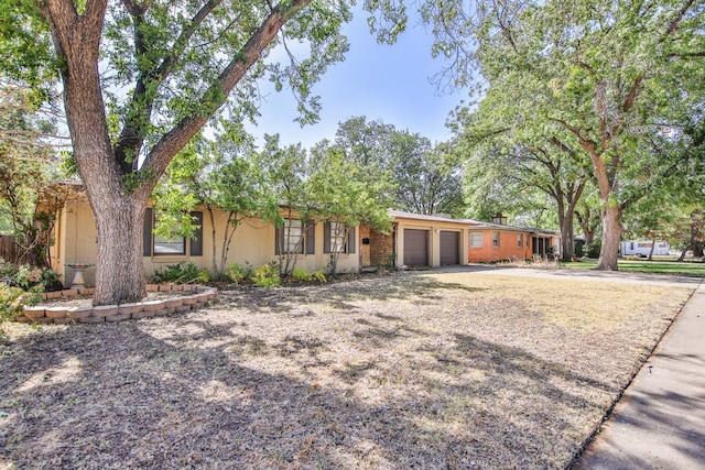 ranch-style house featuring a garage