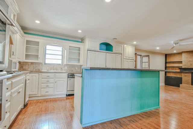 kitchen with white cabinetry and light hardwood / wood-style flooring