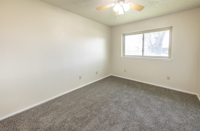 empty room featuring ceiling fan, carpet flooring, and a textured ceiling