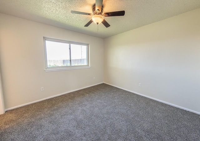 carpeted spare room featuring ceiling fan and a textured ceiling