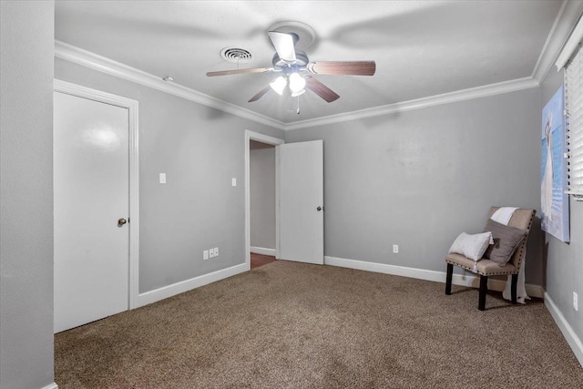 unfurnished room with crown molding, ceiling fan, and carpet