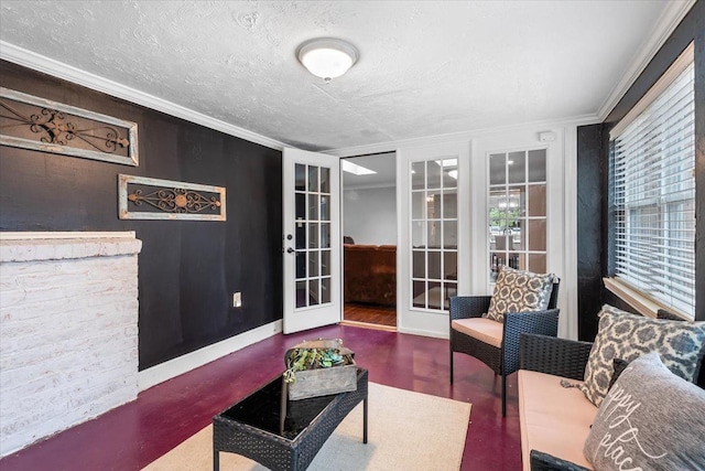 living room with ornamental molding, a textured ceiling, and french doors