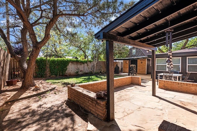 view of patio featuring an outdoor structure