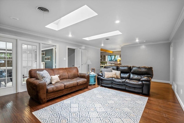 living room with crown molding, wood-type flooring, and a skylight