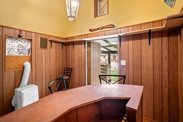 office area featuring wood walls