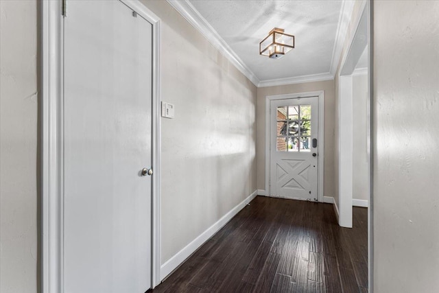 doorway to outside featuring crown molding, dark hardwood / wood-style floors, and a textured ceiling