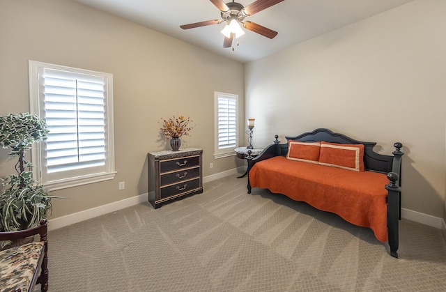 carpeted bedroom featuring a ceiling fan, lofted ceiling, and baseboards