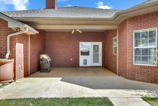 view of patio / terrace featuring a grill and ceiling fan