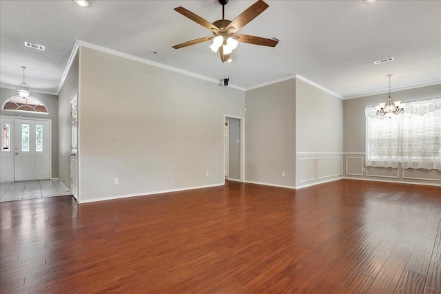 unfurnished living room featuring dark hardwood / wood-style flooring, ceiling fan with notable chandelier, and a textured ceiling