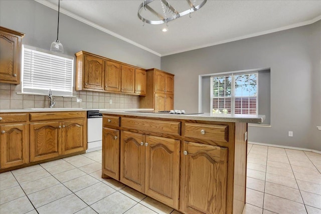 kitchen with pendant lighting, backsplash, dishwasher, and light tile patterned flooring