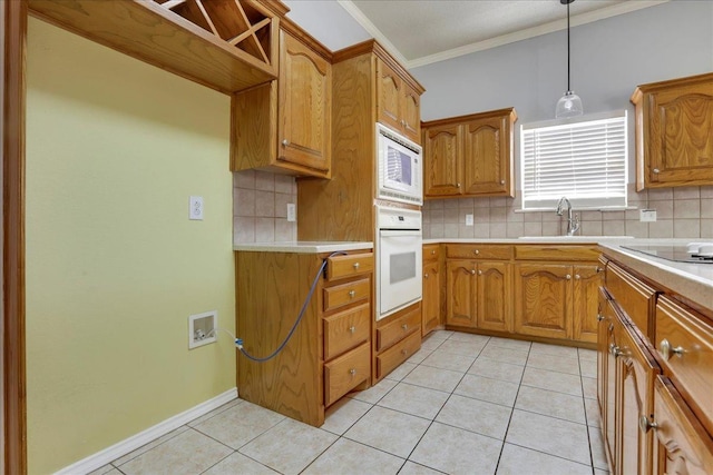 kitchen featuring white appliances, decorative light fixtures, decorative backsplash, and light tile patterned floors