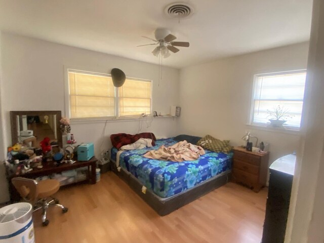 bedroom featuring ceiling fan and wood-type flooring