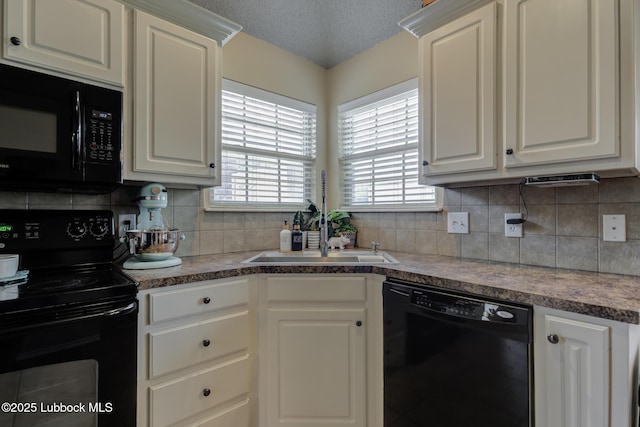1310 Yorkshire Ave, Wolfforth, TX 79382 - kitchen with white cabinetry, a textured ceiling, black appliances, and tasteful backsplash