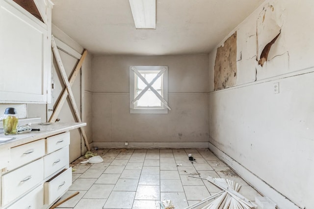 interior space featuring light tile patterned floors