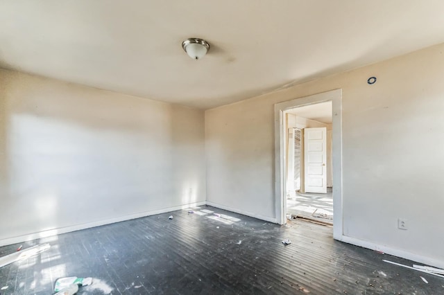 spare room featuring dark hardwood / wood-style floors