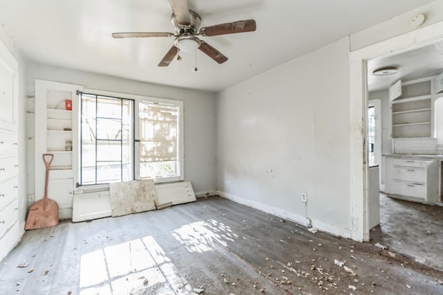 spare room with wood-type flooring and ceiling fan