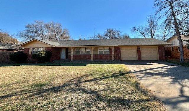 ranch-style home with a garage and a front yard