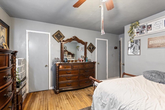 bedroom with light wood-style floors and ceiling fan