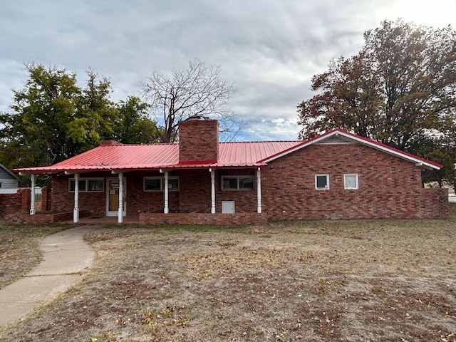 ranch-style house with a front lawn