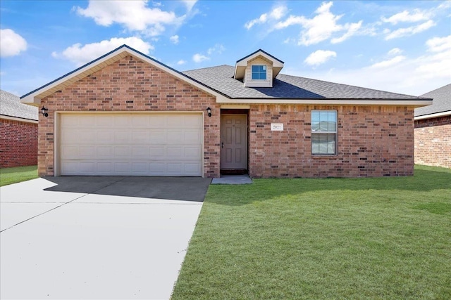 view of front of home featuring a garage and a front lawn